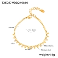 Vista detallada de la pulsera de acero de titanio chapado en oro 18k con diamantes y bolas - Pulsera (TXE087) / Dorado