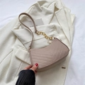 Chic beige V-quilted underarm bag with gold chain strap on white blazer background - Khaki
