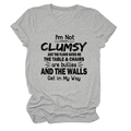 Close-up of I'M NOT CLUMSY text print on grey cotton crewneck short sleeve t-shirt - S / Tops / Light Grey (Black Text)