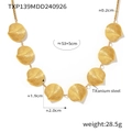 Golden titanium steel necklace with seven spiral shell pendants on a white background - Gold Necklace (TXP139)