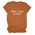 Detail of caramel orange t-shirt with Wait I see a rock printed text on white background - Burnt Orange (White Font)