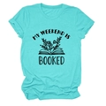 Detail of Tiffany blue T-shirt featuring My Weekend Is Booked book and floral graphic - Deep Water Blue (Black Letters)