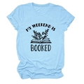 Detail of the light blue t-shirt featuring MY WEEKEND IS BOOKED text and book graphic - Light Blue (Black Letters)