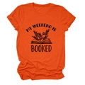 Close-up of My Weekend Is Booked graphic print on orange crew neck cotton t-shirt - Orange (Black Letters)