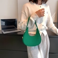 Minimalist green crescent shoulder bag in lychee pattern faux leather with silver buckle - Green