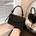 Classic black woven crossbody bag with elegant gold clasp and decorative knotted handle - Black
