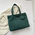 Detail of dark green corduroy tote bag featuring a detachable small round coin purse - Green