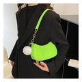 Detail view of quilted neon green crescent shoulder bag with gold chain and white pompom - Light Green