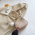Beige chevron quilted baguette bag with gold chain and white fur pompom charm - Khaki