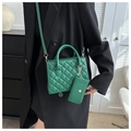 Quilted green crossbody bag with matching coin purse shown on a black blazer - Green