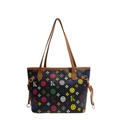 Zwarte shopper met kleurrijke monogramprint en bruine lederen handvaten op wit - Zwart