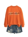 Flat lay of an orange crewneck Pickleball sweatshirt paired with distressed denim shorts - S / Tops / Orange (Black Print)