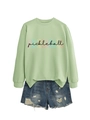 Detail of light green crewneck sweatshirt with pickleball print and denim shorts - S / Tops / Olive Green (Black Letters)