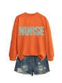 Detail of orange nurse sweatshirt with stethoscope typography and denim shorts - Orange