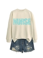 Detail of beige nurse sweatshirt with blue typography and stethoscope pattern - Sand