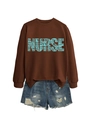 Detail of NURSE letter graphic with stethoscope motifs on a brown sweatshirt - Coffee