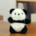 Cute plush panda keychain with black and white fur and green backpack straps - Backpack Style / Black and White / About 12cm