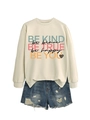 Close-up of beige crewneck sweatshirt with 'BE KIND' print and side slit hem detail - Sand