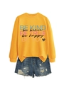 Orange crewneck sweatshirt with 'Be Brave' graphic and leopard heart detail next to denim shorts - Yellow