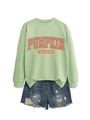 Gros plan du motif Pumpkin Season sur sweat vert menthe avec short en jean usé - Vert olive