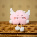 Close-up of pink plush star pendant with white wings and embroidered cute face detail - Pink