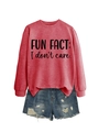 Detail of red crewneck sweatshirt with 'FUN FACT: I don't care' text and denim shorts - Red Sweatshirt (Black Font)