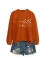 Close-up of hello FORTY sweatshirt with heart motif and distressed denim shorts - Burnt Orange (White Font)