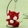 Plush red fox charm with golden embroidery and metal keychain hanging on a stand - Red / About 13cm
