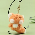 Cute orange fox plush keychain with soft fur and golden clip on a green background - Orange / About 13cm