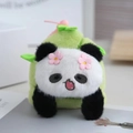 Cute panda panda plush charm in light green finish with floral headpiece and soft texture - Surprised Style