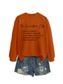 Flat lay of an orange crewneck sweatshirt featuring The Grandma Code graphic print - Burnt Orange (Black Font)