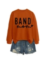 Flat lay of an orange crew neck BAND mom sweatshirt with distressed blue denim shorts - Burnt Orange (Black Font)