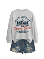 Flat lay of gray sweatshirt with vintage camp fire graphic and distressed denim shorts - Gray