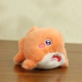 Cute orange plush sea creature keychain with soft fur and embroidered details - Orange Shark