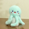 Cute plush octopus keychain in mint green with soft fur and embroidered face - Blue Octopus