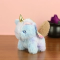 Detail shot of a plush unicorn keychain with golden horn and colorful gradient wings - G Blue