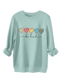 Détail des poignets côtelés du sweat vert menthe et texture imprimée 'be kind' - Vert clair
