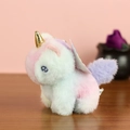 Macro shot of fluffy gradient plush unicorn with golden horn and blue embroidery - G Mixed Colors