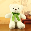 White teddy bear plush toy with a vibrant green silk ribbon bow on a wooden surface - White with Green Ribbon
