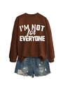 Close-up of brown sweatshirt with I'm Not For Everyone text and ripped denim shorts - S / Coffee (White Font)