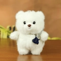 Portachiavi orsetto di peluche bianco con chitarra blu su fondo in legno caldo - Bianco Sporco