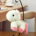 Cute white plush pony keychain with pink accents and a small golden bell charm - White Pink