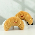 Cute plush croissant keychain set in warm yellow with smiling emoji and soft texture - Croissant