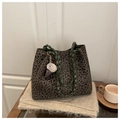 Detail of leopard print tote bag featuring dark green woven handles and plush charm - With Pendant / Dark Green