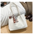 Detail of off-white faux leather tote bag with elegant printed scarf on the handle - White
