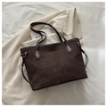 Deep brown matte suede tote bag with leather handles shown on a beige blazer - No Pendant / Brown
