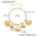 Detail of stainless steel bead chain bracelet featuring multiple gold shell pendants - Mixed Shell Charms (E688)