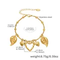 Detail of stainless steel charm bracelet with hollow heart and leaf pendants on white base - Hollow Heart And Leaf Charms (E690)