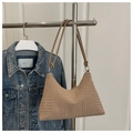 Detail of tan checkered tote bag with textured geometric embossing and round leather strap - Khaki