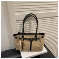 Close-up of beige faux suede tote bag with black leather straps and retro beaded charm - Khaki With Pendant